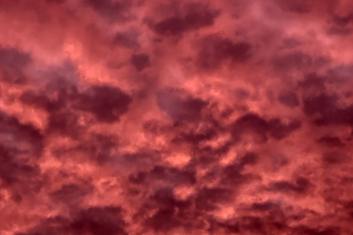 Clouds in shades of deep red and purple